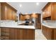 Well-appointed kitchen featuring custom wood cabinets, stainless steel appliances, and pristine white countertops at 3517 Eden Croft Dr, Raleigh, NC 27612