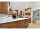 Stylish kitchen with stainless steel appliances, custom wood cabinets, and bright countertops at 3517 Eden Croft Dr, Raleigh, NC 27612