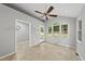Bright sunroom with vaulted ceiling, multiple windows with tiled floor, and access to the outdoors at 3517 Eden Croft Dr, Raleigh, NC 27612