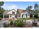Beautiful backyard with a deck, patio, and lush landscaping creates a serene outdoor living space at 387 Riverstone Dr, Pittsboro, NC 27312