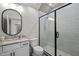 Modern bathroom featuring a glass-enclosed shower and sleek vanity at 387 Riverstone Dr, Pittsboro, NC 27312