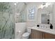 Bathroom featuring a glass-enclosed shower, modern sink, and marble countertops at 387 Riverstone Dr, Pittsboro, NC 27312