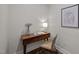 Charming workspace featuring a stylish wooden desk, chair, and decorative lamp, perfect for a home office nook at 387 Riverstone Dr, Pittsboro, NC 27312