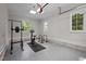 Well-lit garage featuring an exercise area with equipment, offering a convenient space for fitness routines at 387 Riverstone Dr, Pittsboro, NC 27312