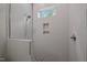 Modern walk-in shower with vertical tiling, glass enclosure, and a convenient wall niche at 387 Riverstone Dr, Pittsboro, NC 27312