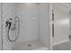 Bright white tiled shower with modern fixtures and sleek design at 387 Riverstone Dr, Pittsboro, NC 27312