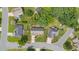 Aerial view showing home and surrounding neighborhood, with mature trees and landscaping at 412 Whitt Ave, Burlington, NC 27215
