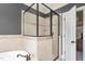 Elegant bathroom featuring a glass-enclosed shower, tile accents, and a luxurious bathtub at 412 Whitt Ave, Burlington, NC 27215