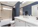 Bathroom featuring a white vanity, updated faucet and fixtures, and a shower with a tub at 412 Whitt Ave, Burlington, NC 27215