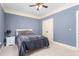 Bedroom with overhead fan, natural light from the window and neutral carpet at 412 Whitt Ave, Burlington, NC 27215