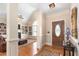 Welcoming foyer with hardwood floors, a stylish console table, and seamless transition to the living room at 412 Whitt Ave, Burlington, NC 27215
