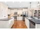 Spacious kitchen featuring stainless steel appliances, ample cabinetry, hardwood floors, and granite countertops at 412 Whitt Ave, Burlington, NC 27215