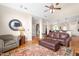 Open living room with a vaulted ceiling, hardwood floors, and smooth transitions to other rooms at 412 Whitt Ave, Burlington, NC 27215