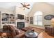 Inviting living room with a vaulted ceiling, built-in bookshelves, and a cozy fireplace at 412 Whitt Ave, Burlington, NC 27215