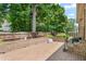 Brick patio area with an outside grill and fenced backyard at 412 Whitt Ave, Burlington, NC 27215