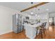 Modern kitchen featuring stainless steel appliances, white cabinets, and a center island at 420 Nelson St, Durham, NC 27707