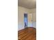 Bedroom featuring hardwood flooring with view of a bathroom at 426 Smith St, Burlington, NC 27217