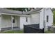 Home exterior with white siding, a small covered back porch, and a well-maintained yard at 426 Smith St, Burlington, NC 27217