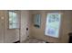 A utility area of the kitchen with a door to the outside and a window at 426 Smith St, Burlington, NC 27217