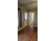 Interior living space with hardwood floors, a window, and a doorway leading to the bedrooms at 426 Smith St, Burlington, NC 27217