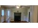 Interior shot of a living area highlighting the fireplace, flooring, and a view of another room at 426 Smith St, Burlington, NC 27217