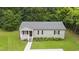 Home exterior showcasing the front facade, neat landscaping, and inviting entrance at 427 Elm Ct, Burlington, NC 27217