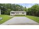 Inviting single-story home with a well-kept front yard and long driveway for easy parking at 427 Elm Ct, Burlington, NC 27217