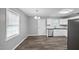 Kitchen features white cabinets, stainless steel appliances, and hardwood floors at 427 Elm Ct, Burlington, NC 27217