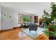 Inviting living room with natural light, stylish furniture, and beautiful hardwood floors at 4703 Pleasant Green Rd, Durham, NC 27705