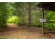 Enjoy the path to the river with a sign marking the location in the woods at 4703 Pleasant Green Rd, Durham, NC 27705