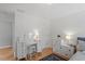 Elegant bedroom featuring stylish furniture, hardwood floors, and a modern ceiling light at 500 Weaver Mine Trl, Chapel Hill, NC 27517