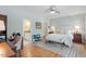 Inviting bedroom with hardwood floors, desk area, and ensuite bathroom access at 500 Weaver Mine Trl, Chapel Hill, NC 27517