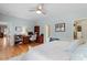 Spacious bedroom with hardwood floors, desk, and ample closet space at 500 Weaver Mine Trl, Chapel Hill, NC 27517