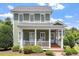 Charming two-story home featuring a welcoming front porch with classic white columns and manicured landscaping at 500 Weaver Mine Trl, Chapel Hill, NC 27517