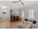 Cozy living room with hardwood floors, a ceiling fan, and comfortable seating at 500 Weaver Mine Trl, Chapel Hill, NC 27517