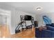 A spacious living room with hardwood floors offers an entertainment system and comfortable sectional sofa at 500 Weaver Mine Trl, Chapel Hill, NC 27517