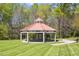 Outdoor pavilion with a red roof, set in a green space with trees in the background at 500 Weaver Mine Trl, Chapel Hill, NC 27517