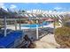 Recreational community pool area with chairs, pergola, and a clear blue pool at 500 Weaver Mine Trl, Chapel Hill, NC 27517