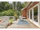 Spacious wooden deck features a table and chairs, perfect for outdoor entertaining at 5405 Doemont Dr, Apex, NC 27539