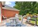 Spacious wooden deck features a table and chairs, perfect for outdoor gatherings at 5405 Doemont Dr, Apex, NC 27539
