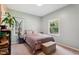 Comfortable bedroom features neutral carpet, a queen-sized bed, and two windows at 5405 Doemont Dr, Apex, NC 27539