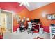 Stylish bedroom features custom-painted walls and ceiling, a desk, and a ceiling fan at 5405 Doemont Dr, Apex, NC 27539