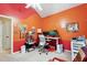 Stylish bedroom features custom-painted walls and ceiling, a desk, and a ceiling fan at 5405 Doemont Dr, Apex, NC 27539