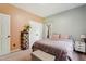 Comfortable bedroom features neutral carpet, a queen-sized bed, and a double-door closet at 5405 Doemont Dr, Apex, NC 27539