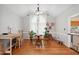 Bright dining room with hardwood floors, neutral walls, and a round table with chairs at 5405 Doemont Dr, Apex, NC 27539