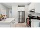 Modern kitchen featuring stainless steel appliances, white cabinets, and tile backsplash at 5405 Doemont Dr, Apex, NC 27539