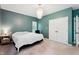 Neutral carpet in a main bedroom showcases a charming chandelier and a double-door closet at 5405 Doemont Dr, Apex, NC 27539