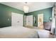 Comfortable main bedroom features neutral carpet, a chandelier, and a double-door closet at 5405 Doemont Dr, Apex, NC 27539