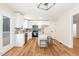 Bright and updated kitchen with stainless appliances, granite countertops, and an island with seating at 5428 Passenger Pl, Raleigh, NC 27603