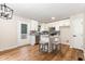 Modern kitchen with stainless steel appliances, granite countertops, and a center island with seating at 5428 Passenger Pl, Raleigh, NC 27603